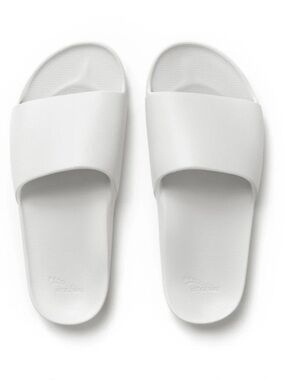 Brand new, never worn white Archie’s slides. Perfect summer essential.